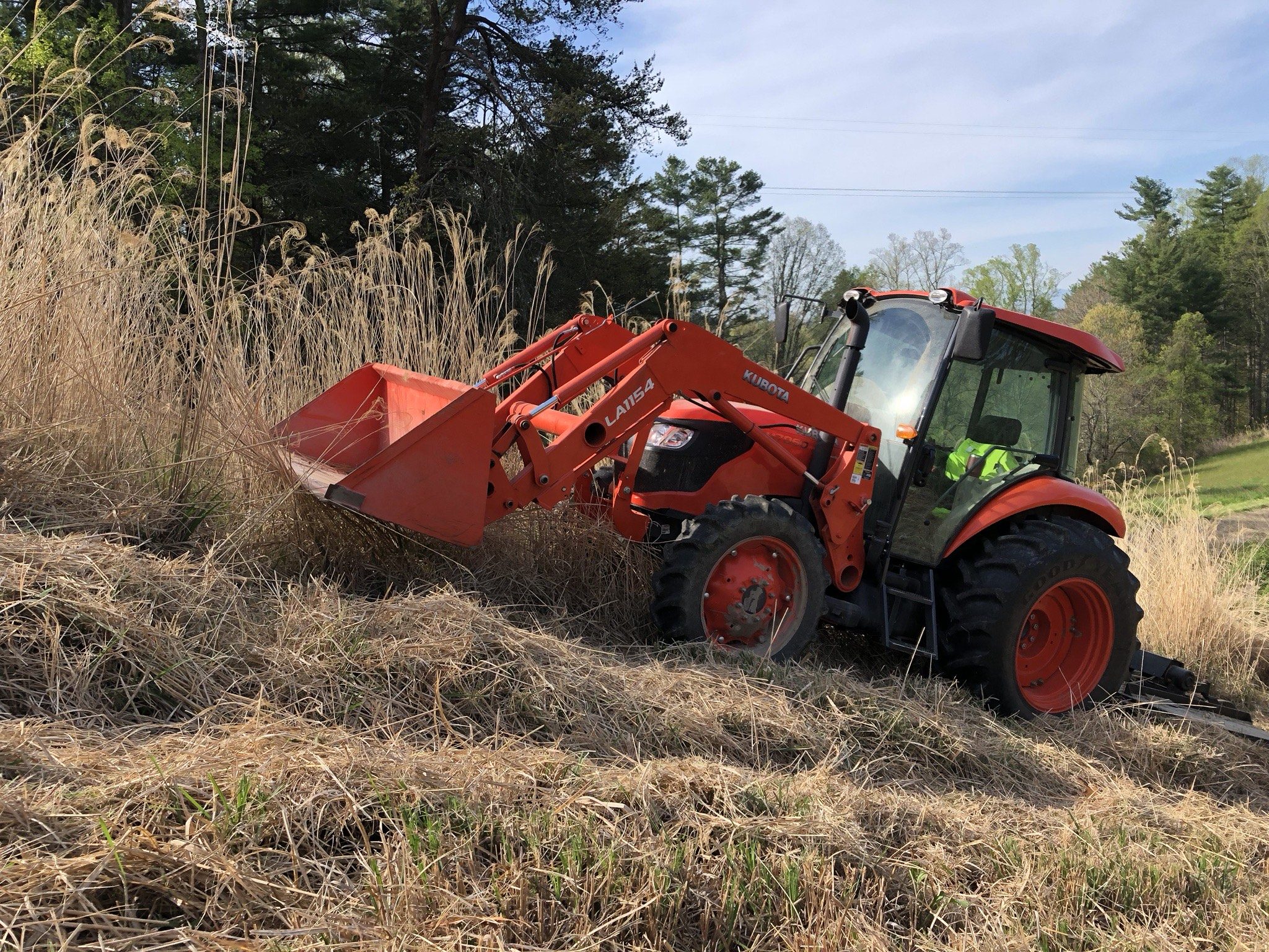 A machine performing bush hogging.