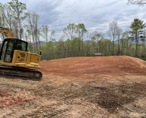 A machine performing land clearing